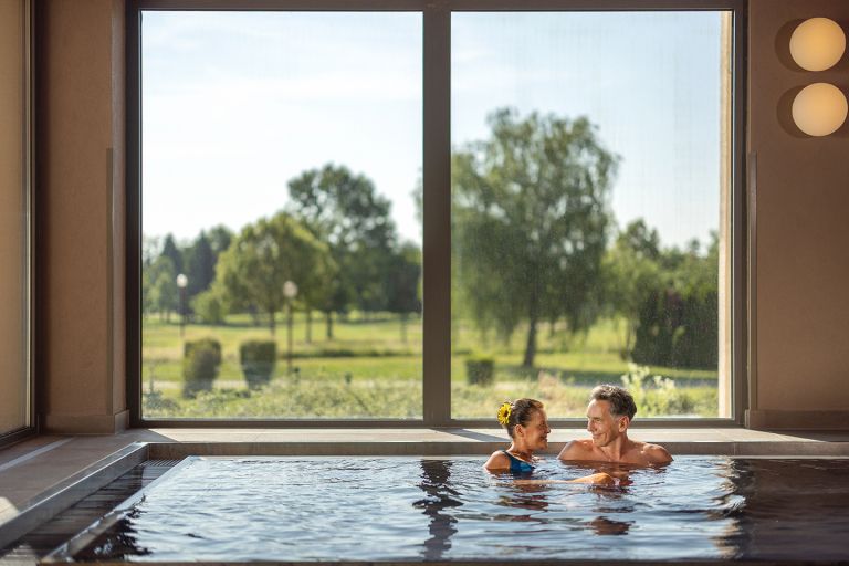 T3_HA_indoor_pool_black_bath_senior_couple_02_TheOther_2025_lowres.jpg