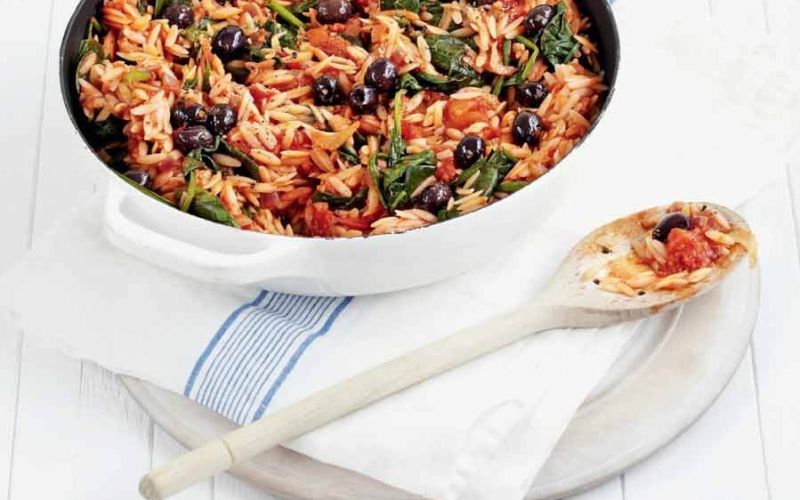 orzo with spinach and cherry tomatoeseat well all weekhealthyadditional information:dirty wooden spoon