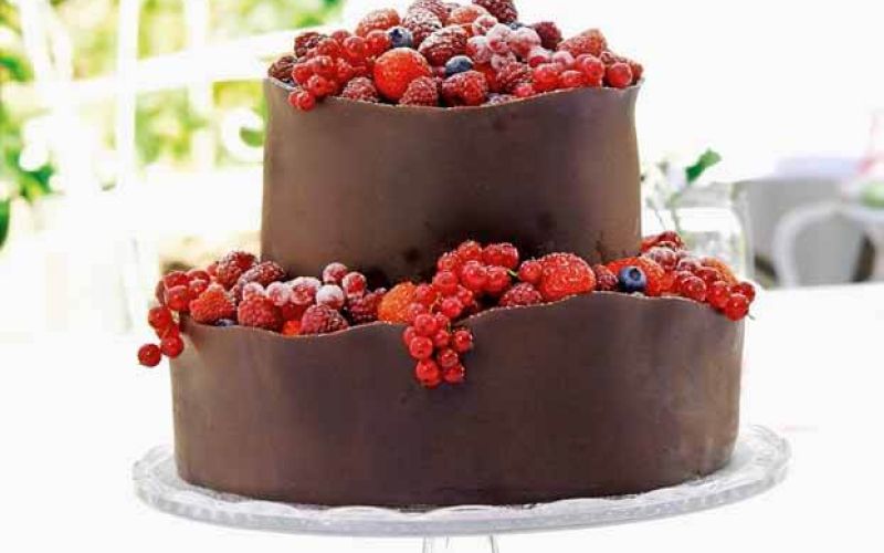 orange berry wedding cake