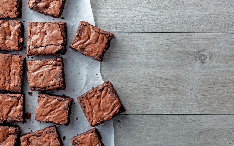 Chocolate,Brownie,On,Paper,On,Dark,Grey,Base,Top,View