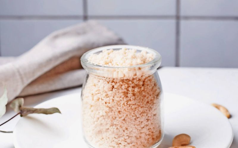 Glass,Jar,With,Vegetarian,Parmesan,Cashew,Nut,Cheese,On,White