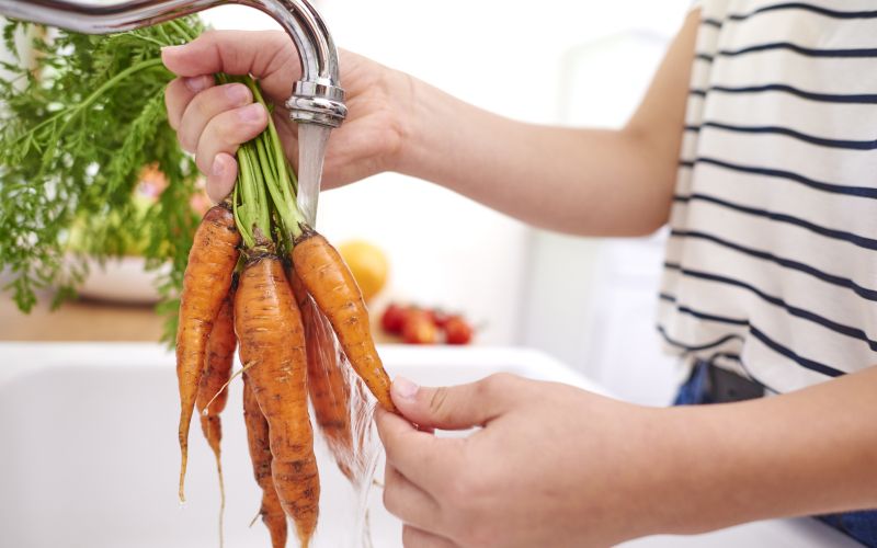 woman-washing-fresh-organic-carrots.jpg