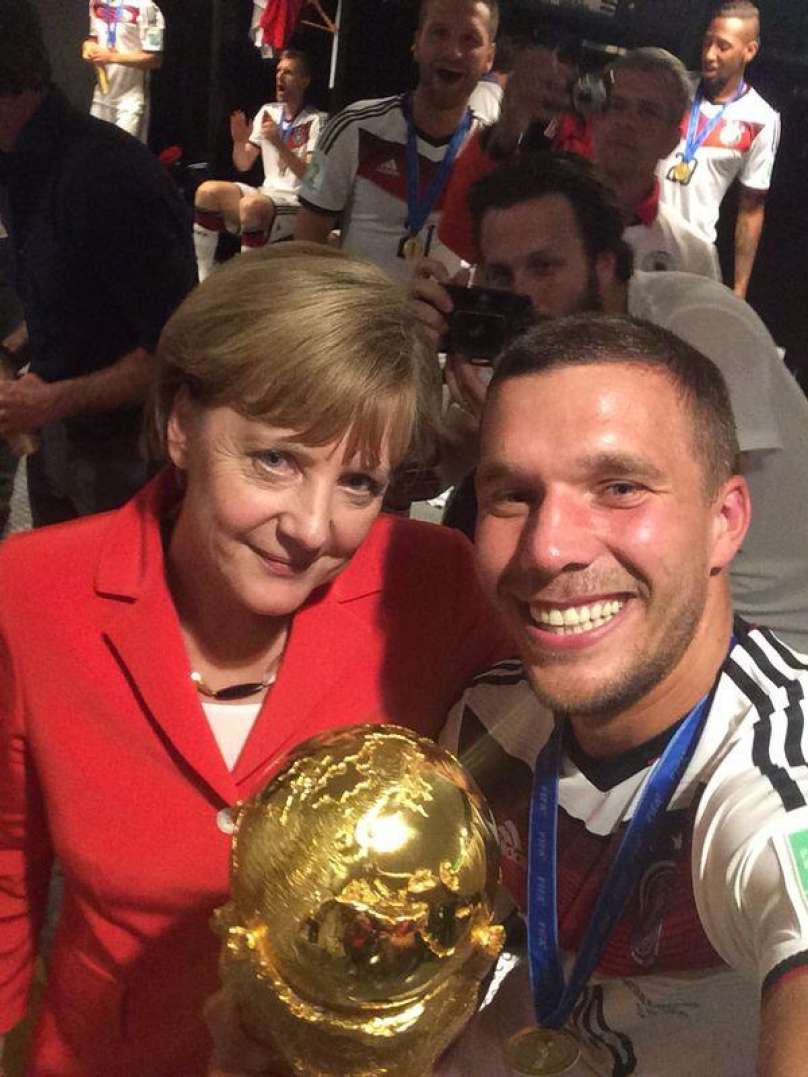 Angela Merkel in Lukas Podolski