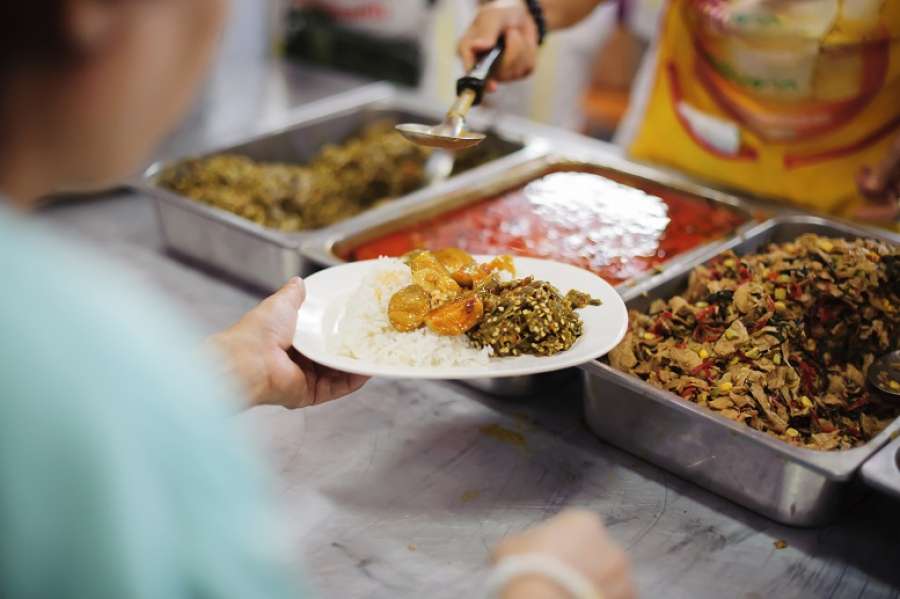 Volunteers serving food for poor people : Food sharing concept